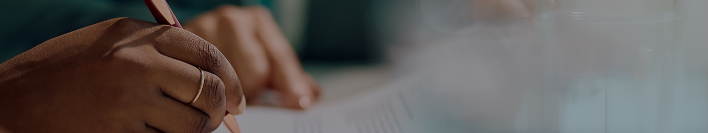 A claims adjuster writing notes related to an insurance claim A claims adjuster writing notes related to an insurance claim