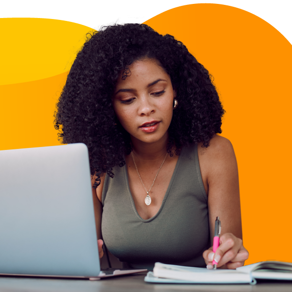 Event planner writing schedule details into a notebook.