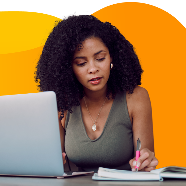 Event planner writing schedule details into a notebook.