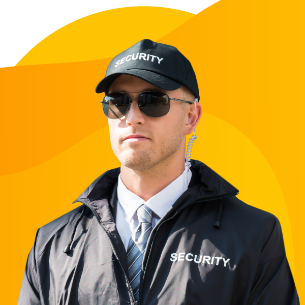 Security guard wearing a security outfit and earwig communication device.