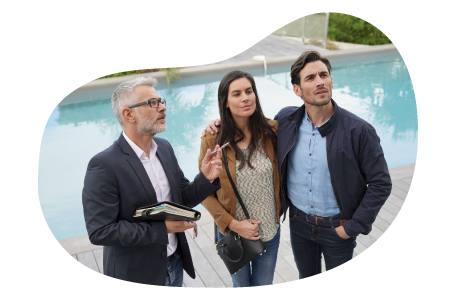 A real estate agent shows a home to prospective buyers.