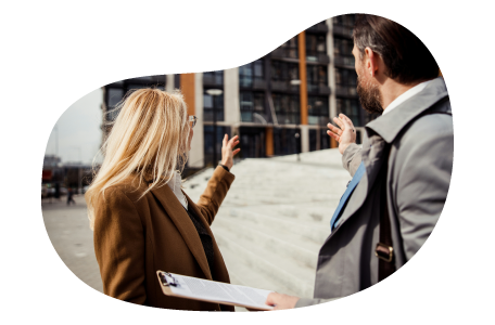 A commercial landlord shows an office to a prospective tenant. A commercial landlord shows an office to a prospective tenant.