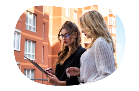 A property manager goes over a lease agreement with a new tenant. A property manager goes over a lease agreement with a new tenant.