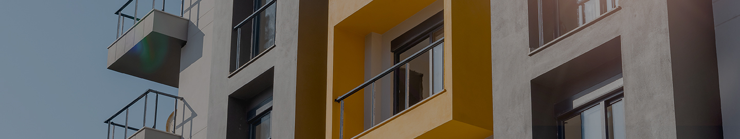 A row of apartments with balconies. A row of apartments with balconies.