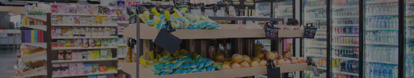 Convenience store shelves stocked with goods Convenience store shelves stocked with goods