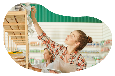 Convenience store worker stocking shelves Convenience store worker stocking shelves