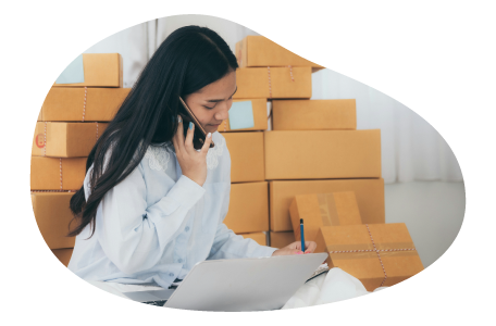 An e-commerce business owner taking a purchase order over the phone