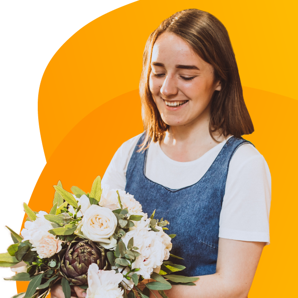 Happy florist with flowers