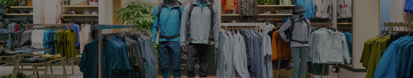 Racks of outdoor apparel at a retail store.