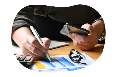 A retail store owner calculating insurance costs. A retail store owner calculating insurance costs.