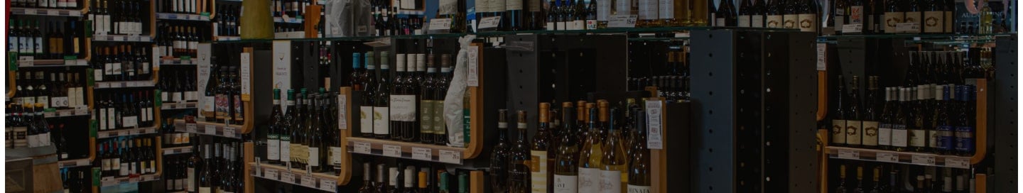 Shelves of wine bottles at a liquor store. Shelves of wine bottles at a liquor store.