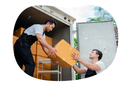 Moving company employees unloading a truck at a new home.