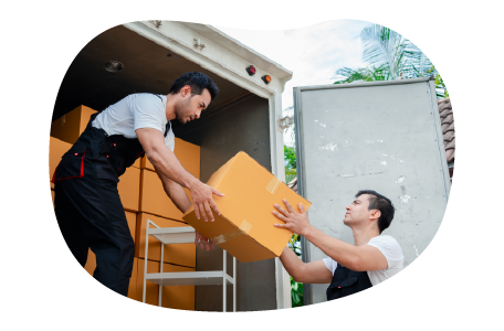 Moving company employees unloading a truck at a new home. Moving company employees unloading a truck at a new home.