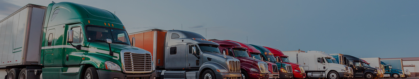 Parked tractor trailers owned by a trucking company. Parked tractor trailers owned by a trucking company.
