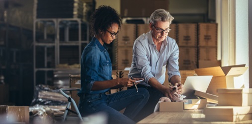 Business owner packaging a product for shipment