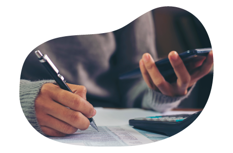 A small business owner calculating the cost of commercial auto insurance. A small business owner calculating the cost of commercial auto insurance.