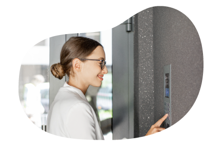 A small business owner setting an alarm inside their storefront. A small business owner setting an alarm inside their storefront.