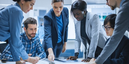 A data breach prevention team in a meeting.