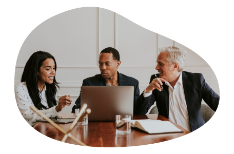 A company director discussing business operations with other board members.