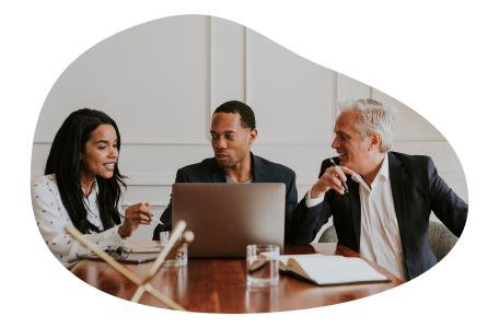 A company director discussing business operations with other board members. A company director discussing business operations with other board members.