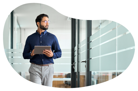 A human resources rep walking through the office of a small business.