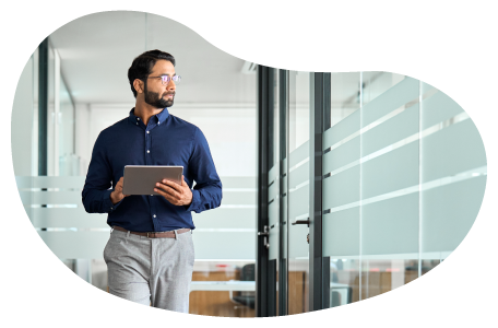 A human resources rep walking through the office of a small business. A human resources rep walking through the office of a small business.