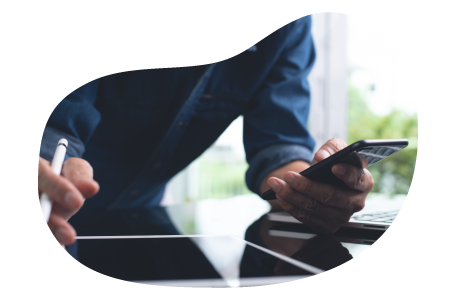 A small business owner calculating the cost of errors and omission insurance. A small business owner calculating the cost of errors and omission insurance.