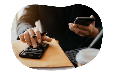 A small business owner calculating a fidelity bond cost. A small business owner calculating a fidelity bond cost.