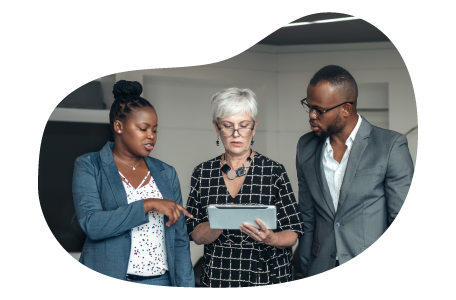 Small business owners reviewing a general liability policy with an insurance agent.