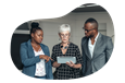 Small business owners reviewing a general liability policy with an insurance agent.
