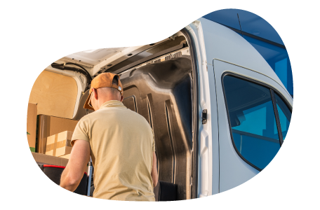 A delivery driver using their personal van to drop off a client's order. A delivery driver using their personal van to drop off a client's order.