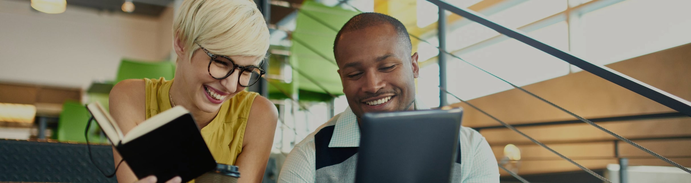 A small business owner and their partner review their insurance options