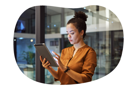 A small business owner reviewing their commercial umbrella policy on a tablet. A small business owner reviewing their commercial umbrella policy on a tablet.