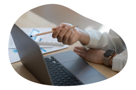 A small business owner calculating the cost of commercial umbrella insurance.