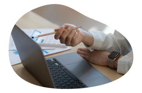 A small business owner calculating the cost of commercial umbrella insurance. A small business owner calculating the cost of commercial umbrella insurance.