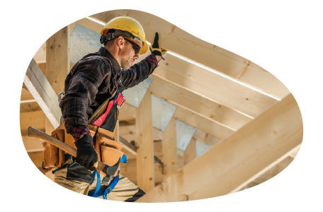 A contractor fixing the roof of a house. A contractor fixing the roof of a house.