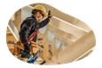 A contractor fixing the roof of a house.
